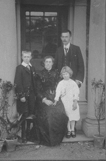 Eli and Sarah Jackson with their two children, Thomas and Susan Hannah. Photograph taken at the Horse and Farrier, Belfield ca.1900.